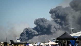 Smoke rises after a Phantom F-4 military jet crashed during the Athens Flying Week air show at the military airport of Tanagra, near Athens on September 5, 2026. (Photo by Theophile BLOUDANIS / AFP)
