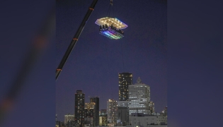 An aerial restaurant in Japan suspended by a crane. (Photo by The Japan News)