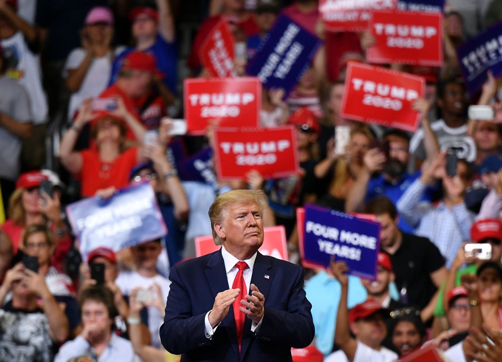 US President Donald Trump gestures after a rally at the Amway Center in Orlando, Florida to officially launch his 2020 campaign on June 18, 2019. / AFP / MANDEL NGAN