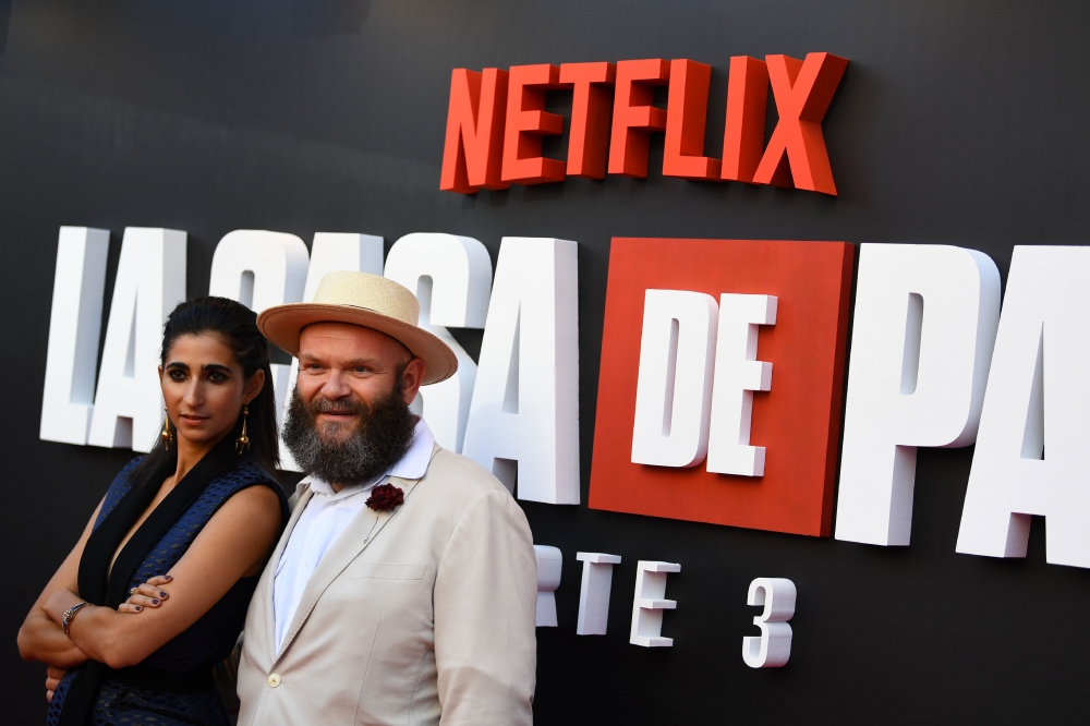 Spanish actress Alba Flores (L) and Serbian actor Darko Peric pose during a photocall for the presentation of the third season of the Spanish TV show