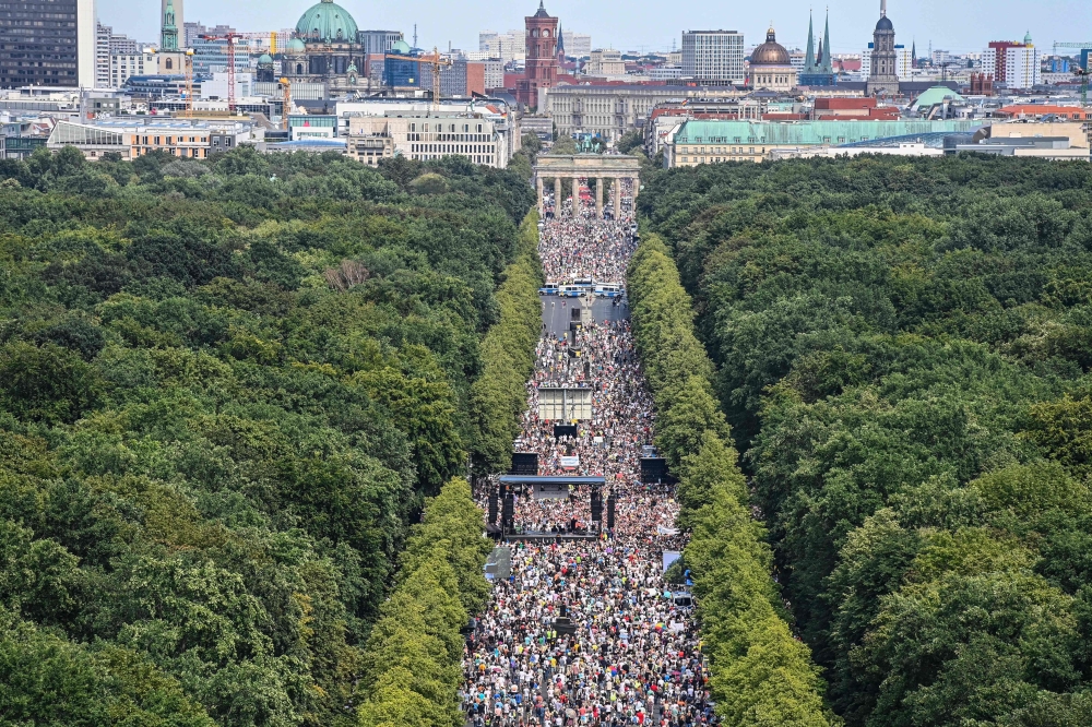People take part in a demonstration by the initiative