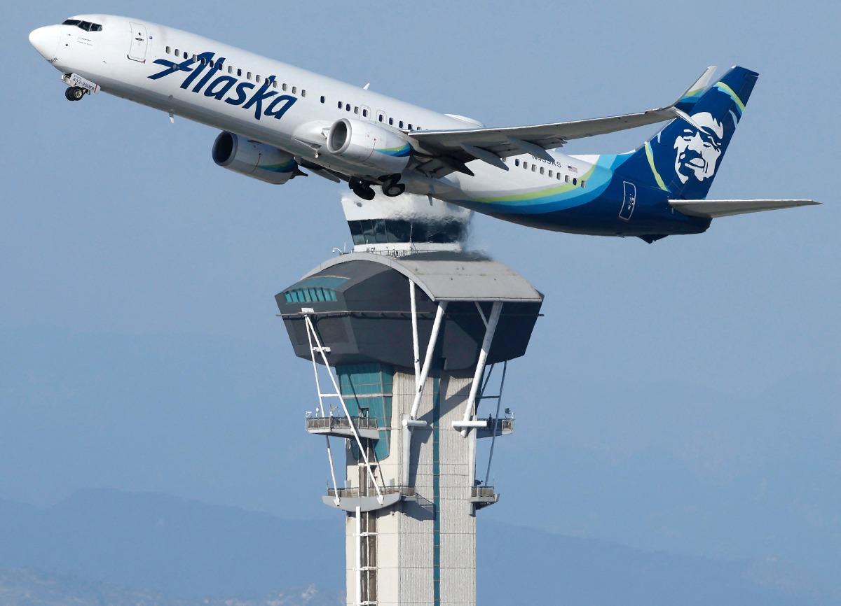 An Alaska Airlines plane takes off near the air traffic control tower at Los Angeles International Airport on October 22, 2025 in Los Angeles, California. Photo by MARIO TAMA / GETTY IMAGES NORTH AMERICA / Getty Images via AFP