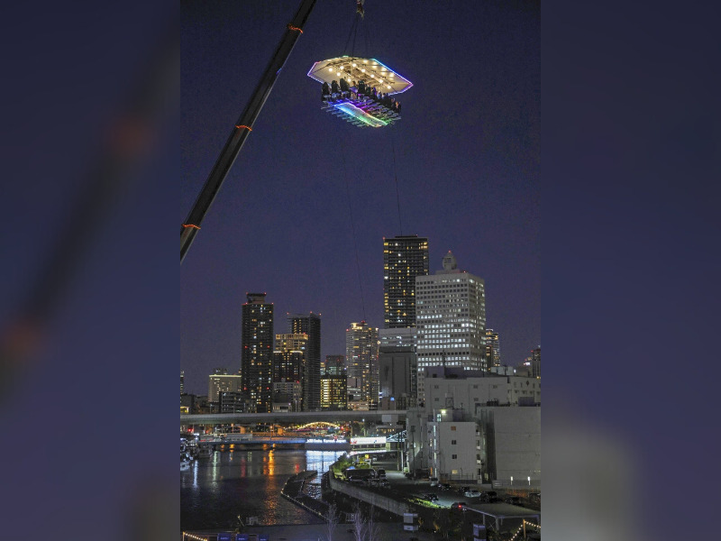 An aerial restaurant in Japan suspended by a crane. (Photo by The Japan News)